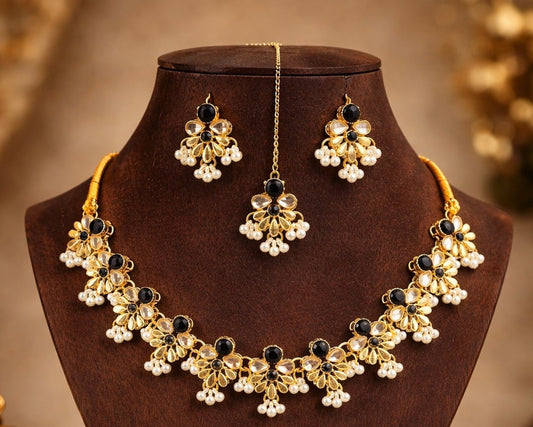 Jewelry set with necklace and earrings on a brown stand