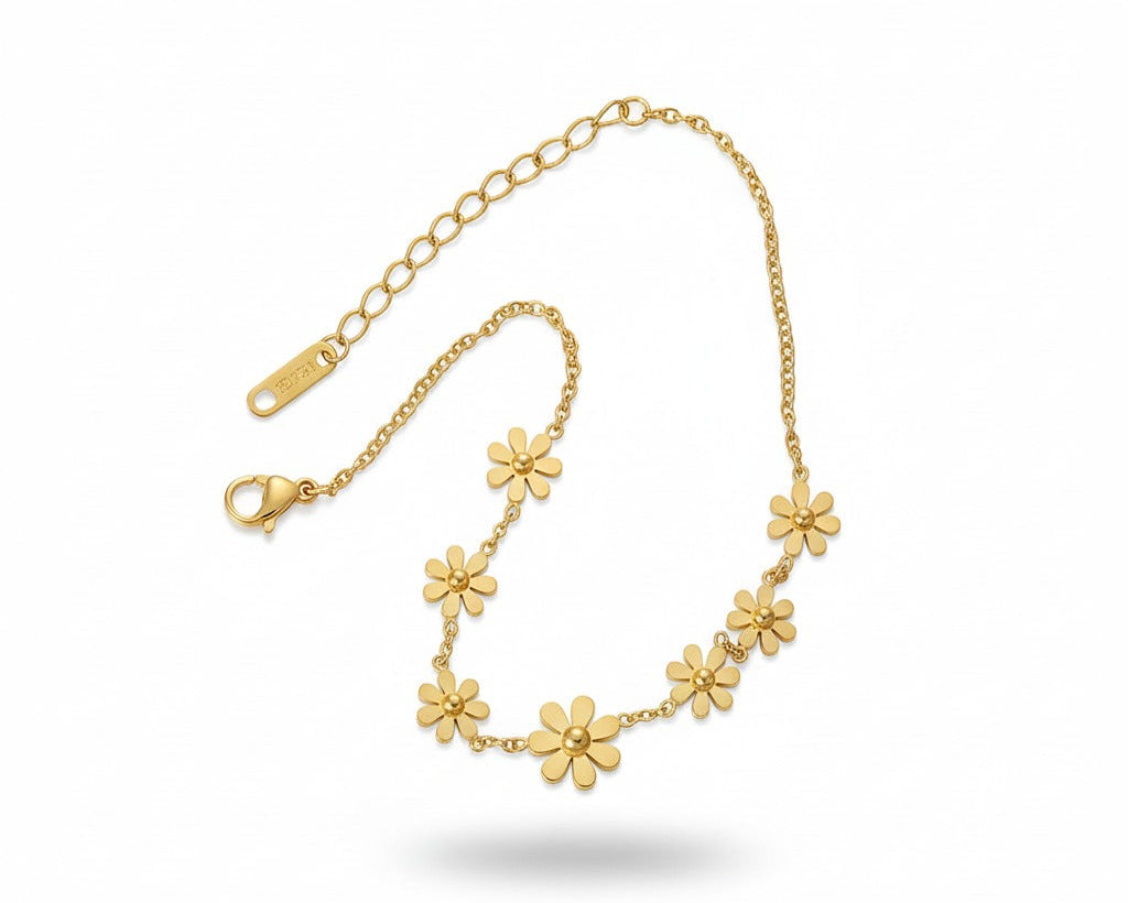 Gold floral bracelet on a white background