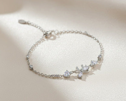Silver bracelet with diamond-like stones on a light background