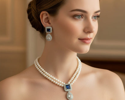 Woman wearing a pearl necklace and earrings with a blurred background